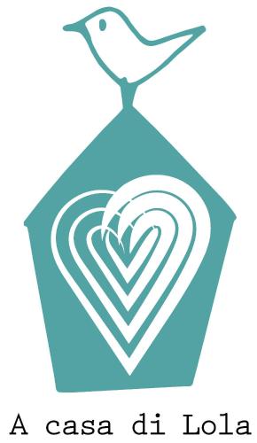 a bird sitting on top of a heart icon at A Casa di Lola in Ascoli Piceno