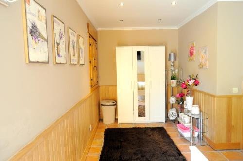 a room with a hallway with a door and a rug at Caserio Kamirune in Laukiz
