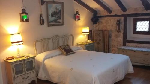 Postel nebo postele na pokoji v ubytování Hotel Rural "El secreto del Castillo"