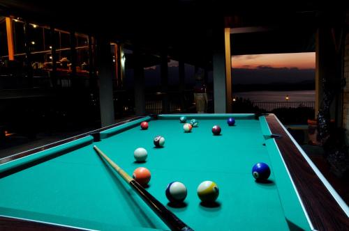 a pool table with balls on top of it at Lavendish Lake Giritale in Polonnaruwa