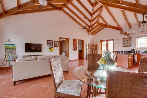 a living room with a couch and a table at Naïa Resort and Spa in Placencia Village
