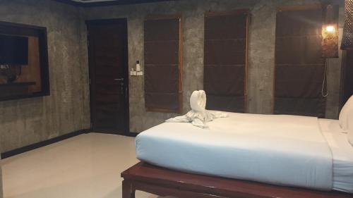 Letto o letti in una camera di JJ Bungalow