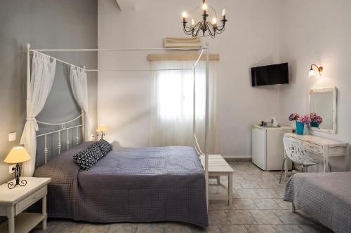 Postel nebo postele na pokoji v ubytování Afrodete Hotel