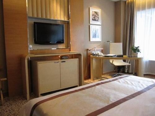 TV a/nebo společenská místnost v ubytování Glarun Jinling Hotel