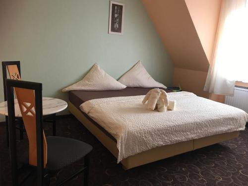 Postel nebo postele na pokoji v ubytování Hotel Seemeile