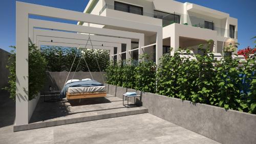 a bed on a swing in front of a house at Thea Sunrise Luxury Villa with Heated Eco Pool in Kallithea Rhodes