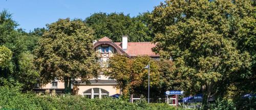 a large building with a tree in front of it at Waldhaus Jakob in Konstanz
