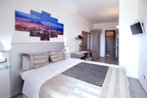 a bedroom with a large white bed in a room at The Stunning B&B in Peschici