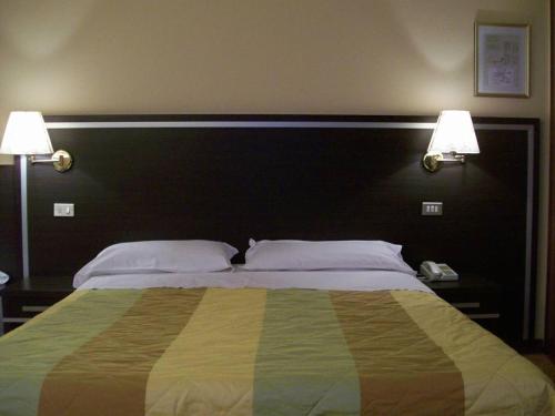 Cama o camas de una habitación en Hotel La Rosta