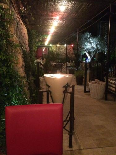 a room with a table and a candle in it at Le Trésor des Templiers in Malataverne
