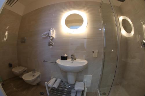 a bathroom with a sink and a shower at Ville Vesuviane in San Giorgio a Cremano