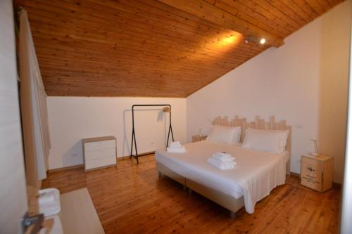 מיטה או מיטות בחדר ב-Tambù Apartments