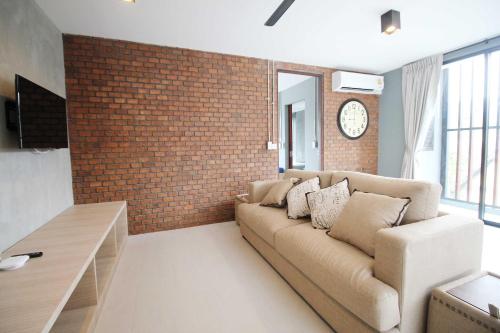 Unique Loft Apartment tesisinde bir oturma alanı