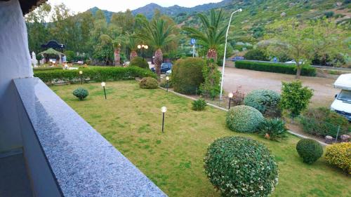 a garden with bushes and lights on the grass at Il Complesso Saraceno in Torre delle Stelle