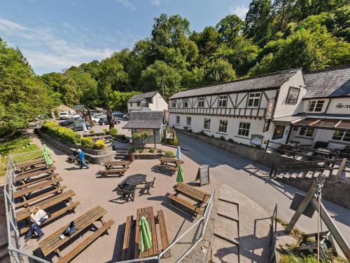 an overhead view of a town with benches and a building at The Saracens Head Inn in Symonds Yat