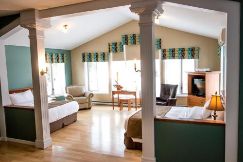 En eller flere senger på et rom på Days Inn by Wyndham Riviere-Du-Loup