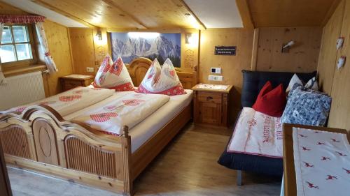 a bedroom with two beds in a cabin at Bauernhof Buchberg in Oberndorf in Tirol
