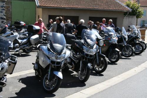 a group of motorcycles parked in a parking lot at Logis Hotel Restaurant Auberge Les Rives de l'Arzon in Vorey