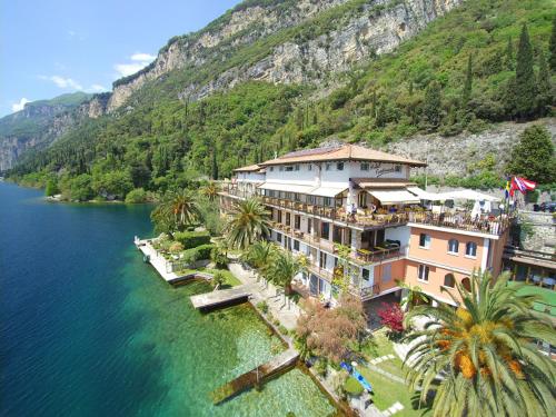 an aerial view of a hotel on the side of a mountain at Hotel Forbisicle in Tignale
