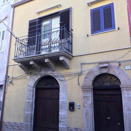 an apartment building with two doors and a balcony at Al Duomo in Partinico