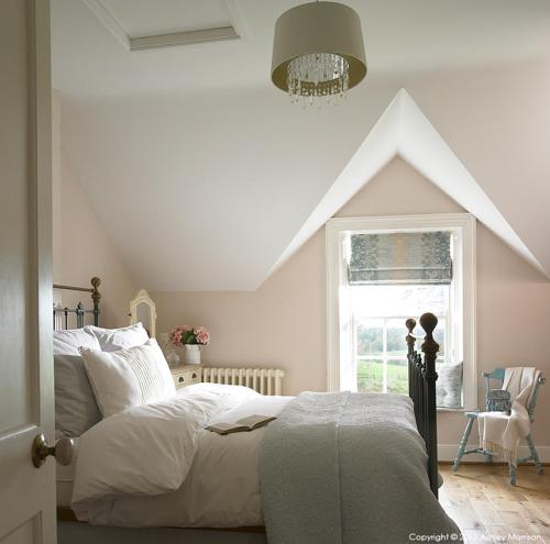 a bedroom with a large bed and a window at The Brook in Enniskillen