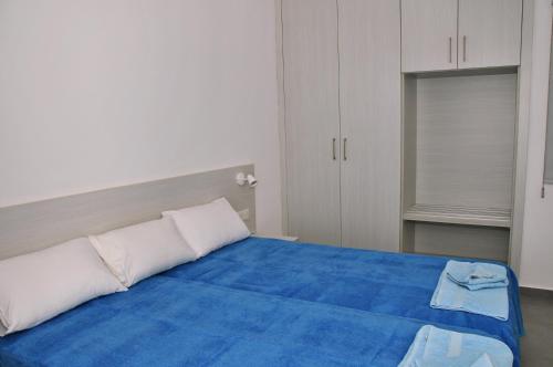 Ένα ή περισσότερα κρεβάτια σε δωμάτιο στο Kaos Hotel Apartments