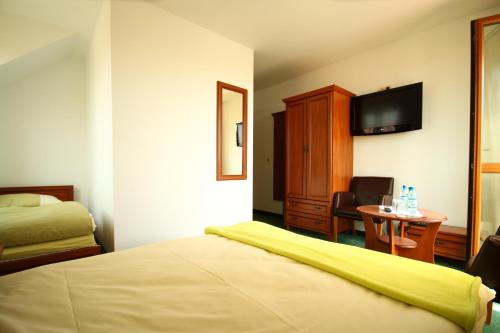 Una cama o camas en una habitación de Klif Spa