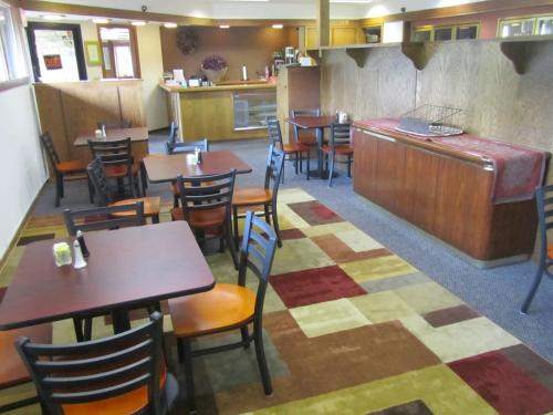 a dining room with tables and chairs in a restaurant at Spring Valley Inn in Spring Green