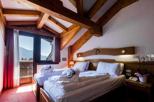 Posteľ alebo postele v izbe v ubytovaní Hotel Collini