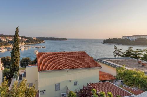 a view of the ocean from a building at Apartments Villa Bartol in Pula
