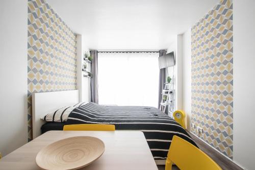 Кровать или кровати в номере Studio Couleur Soleil
