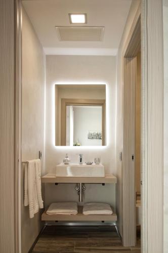 a bathroom with a sink and a mirror at B&B Tre passi in Verona