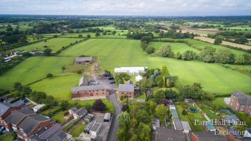 an aerial view of a house in a field at Parr Hall Farm, Eccleston in Eccleston