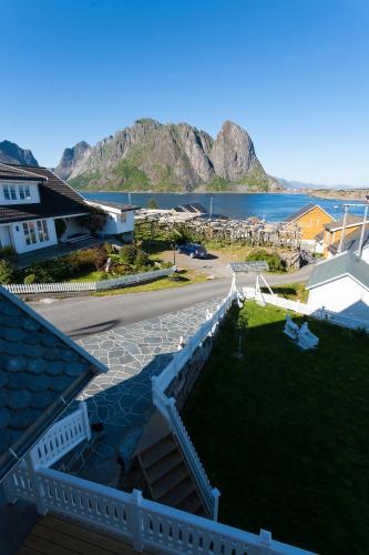 arial view of a resort with a view of the water at Sakrisøy Gjestegård - Manor House in Sakrisøy - Solbakken anno 1880 in Reine