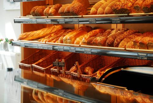 a bakery filled with lots of different types of bread at Aparthotel Paderborn in Paderborn
