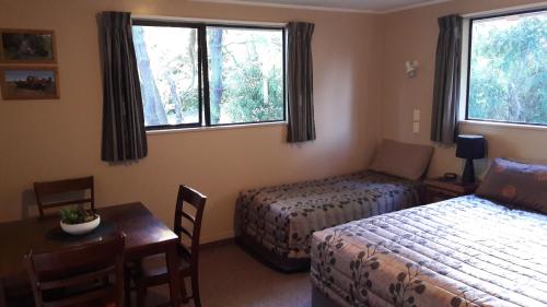 Postel nebo postele na pokoji v ubytování Serenity Motels