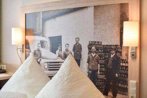 an old photo of a group of men in front of a truck at Landhotel Schnupp in Neudrossenfeld