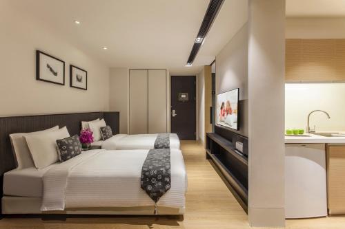 Postel nebo postele na pokoji v ubytování Citadines South Chengdu