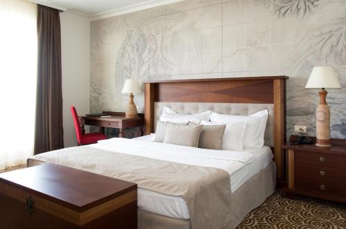 Ένα ή περισσότερα κρεβάτια σε δωμάτιο στο Arena Di Serdica Hotel