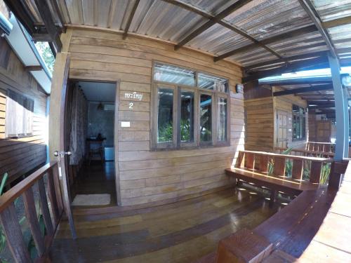 an inside view of a wooden house with a porch at JJ at Chiangkhan in Chiang Khan