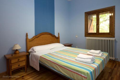 En eller flere senge i et værelse på Albergue Casa Salinas