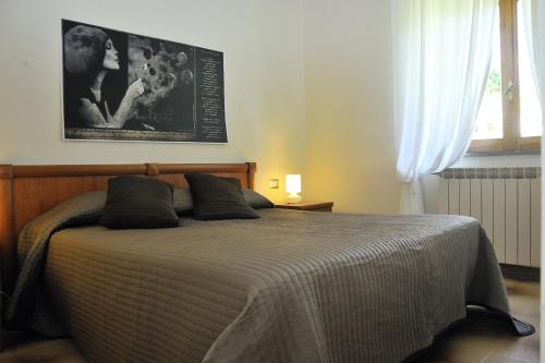 Tempat tidur dalam kamar di Hotel Il Casale