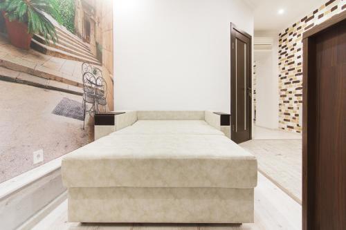 a bedroom with a large bed in a room at Club Suite near Deribasovskaya in Odesa