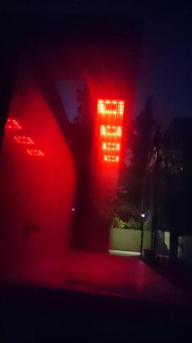 a blurry picture of a red traffic light at night at The Lake House in Fonyód