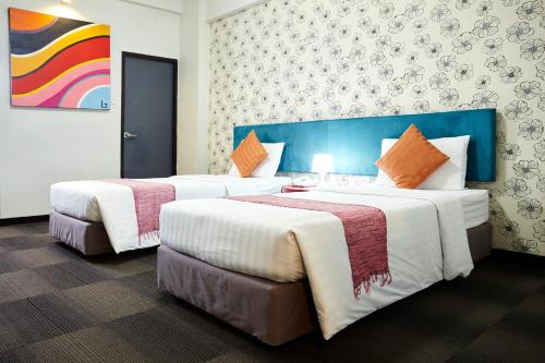 Postel nebo postele na pokoji v ubytování Baiyoke Boutique Hotel