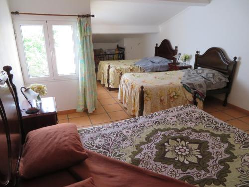 A bed or beds in a room at Casa Formosa