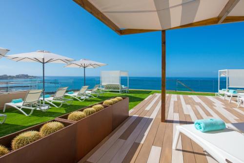 a balcony with a view of the ocean at Iberostar Waves Bouganville Playa in Adeje