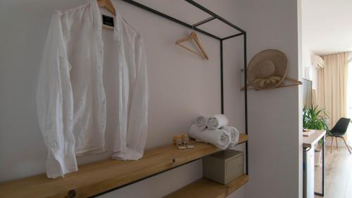 a room with a shelf with towels and a window at The Mint Villa - Saint Vlas in Sveti Vlas