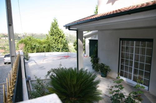 a house with a backyard with a playground at Vila Teixeira in Amarante