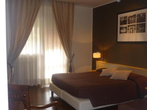 Postel nebo postele na pokoji v ubytování Hotel Ancora Riviera